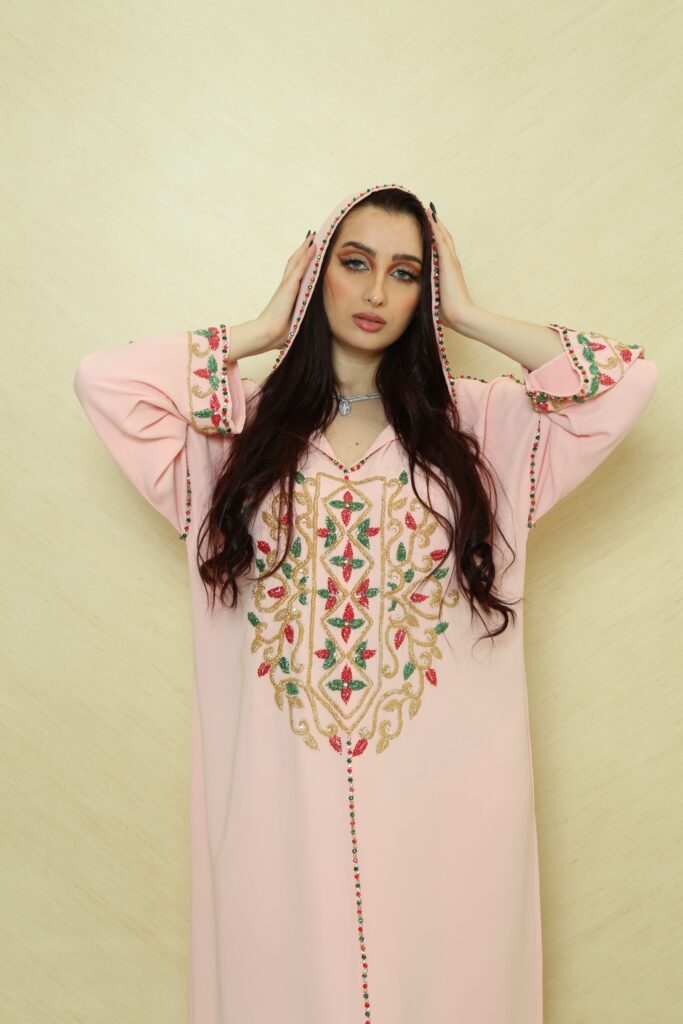 Crystal handmade pink jalabiya, crafted from premium crepe fabric, featuring 250+ hand-embroidered crystals. Perfect for formal occasions, cultural celebrations, and modest fashion.