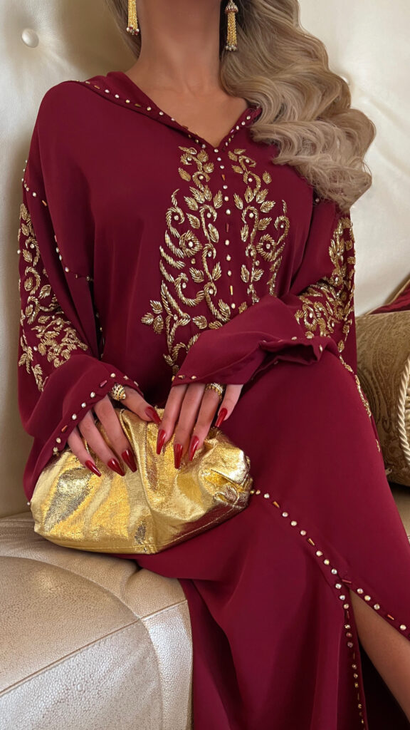 Elegant maroon jalabiya crafted from premium crepe fabric, adorned with 500+ handmade crystals, perfect for weddings, Eid celebrations, and formal events.