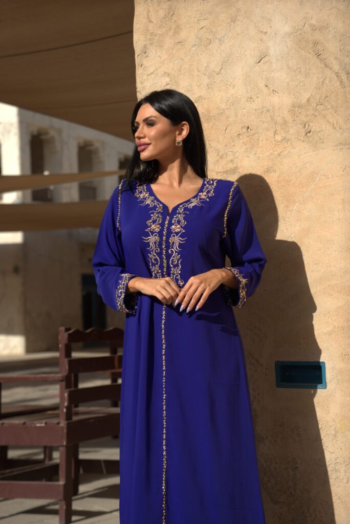 Hand-embroidered blue jalabiya, made from premium crepe, featuring delicate crystal embroidery. Perfect for formal occasions, weddings, and elegant evening wear.