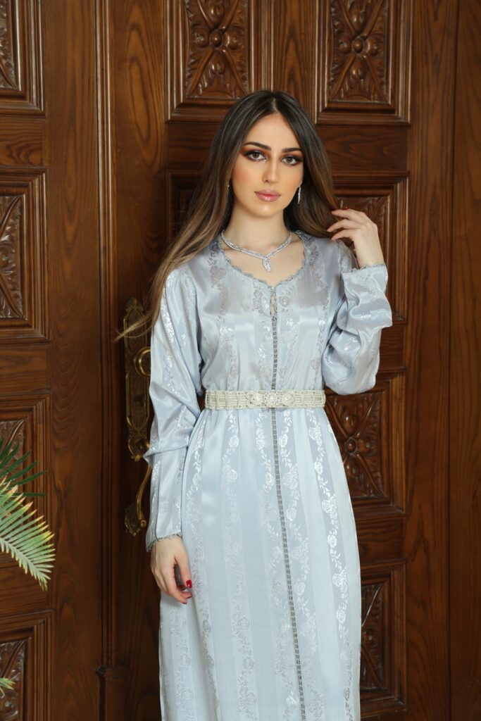 Elegant Handcrafted Randa Dress, made from premium Silk Jawhara Randa, featuring intricate hand-stitched embroidery. Includes a matching belt for a refined silhouette. Ideal for formal occasions, weddings, and cultural celebrations.