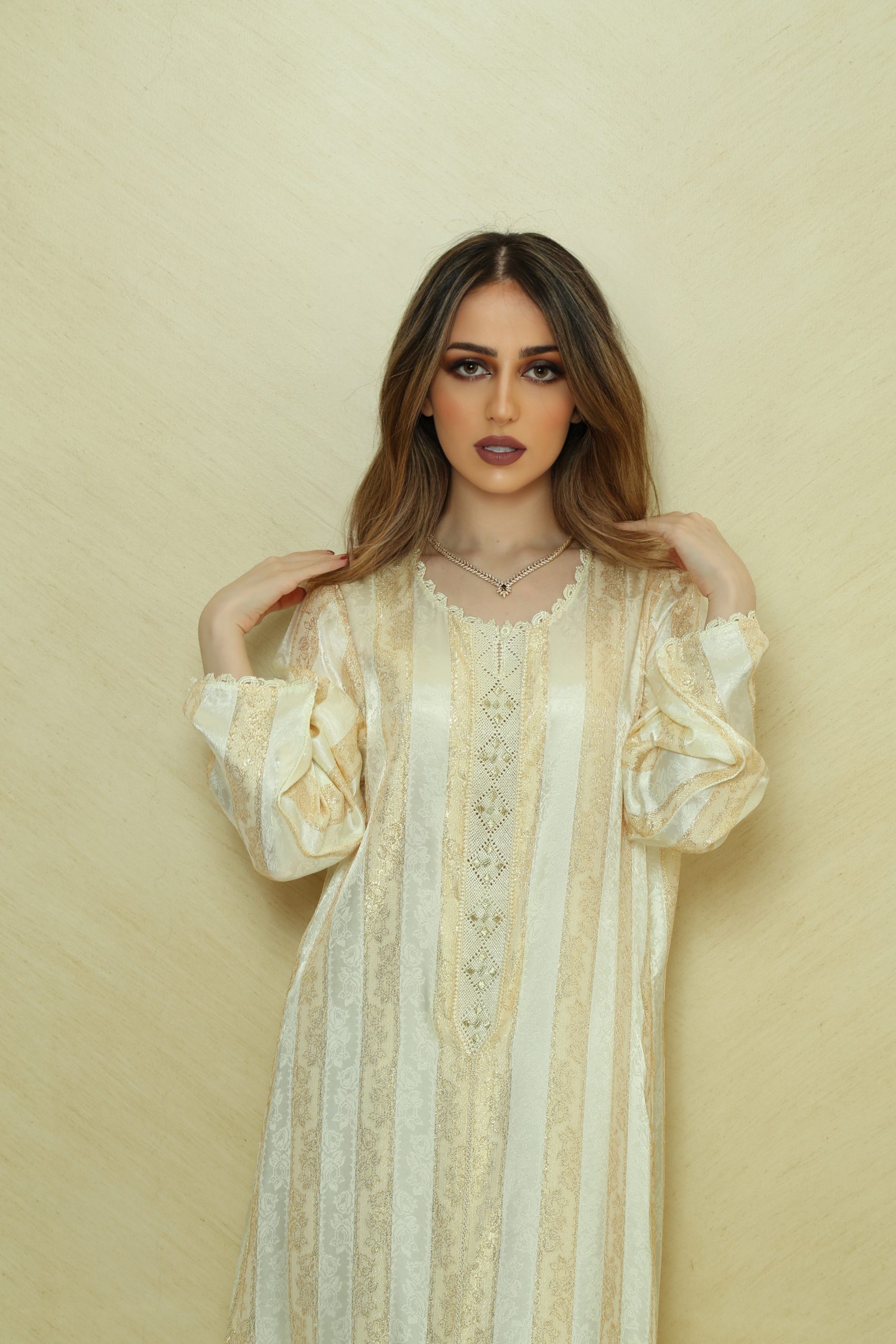 IMG_7642 Elegant Handcrafted Randa Kaftan, made from authentic Silk Jawhara Randa, featuring intricate hand-sewn embroidery. Includes a matching belt for a tailored fit. Perfect for formal occasions, weddings, and cultural events.