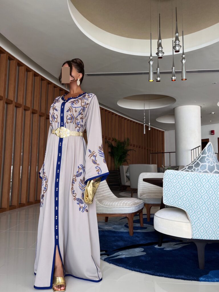 Elegant Hand Embroidered White Kaftan, featuring crystal embellishments on luxurious crepe fabric. Comes with two belts (metal and rope) for versatile styling. Perfect for weddings, festive events, and formal gatherings.